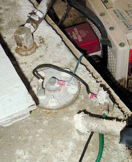 Close up of an aluminum fuel tank with corrosion caused by a bad installation.