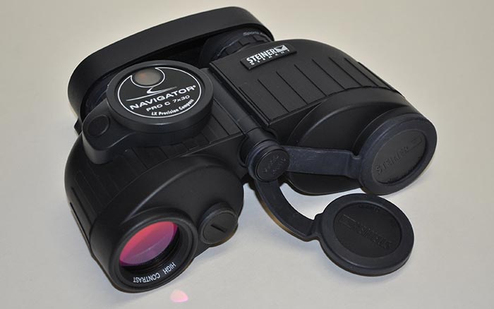 Product photo: Steiner Navigator binoculars on gray background