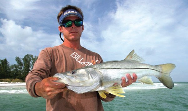 Captain Jason Stock Holding a Spring Snook