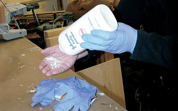 Talc helps latex gloves slip off easily