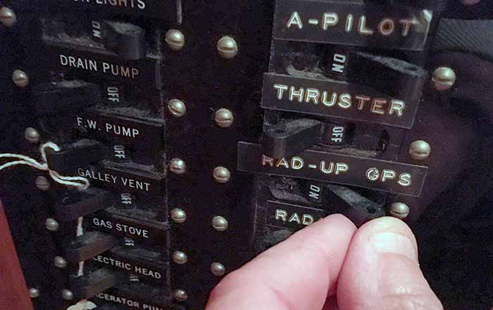 A hand switches a black switch labeled Rad-Up GPS