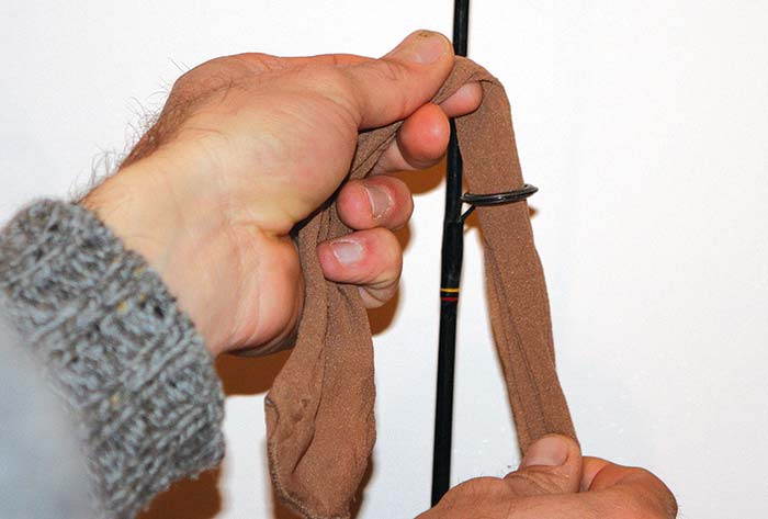 Feeding pantyhouse through a fishing rod where the line normally goes