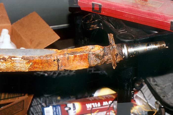 A rusty axel boat part