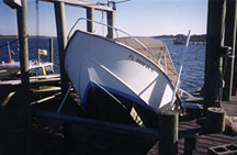 Powerboat toppled over on dock