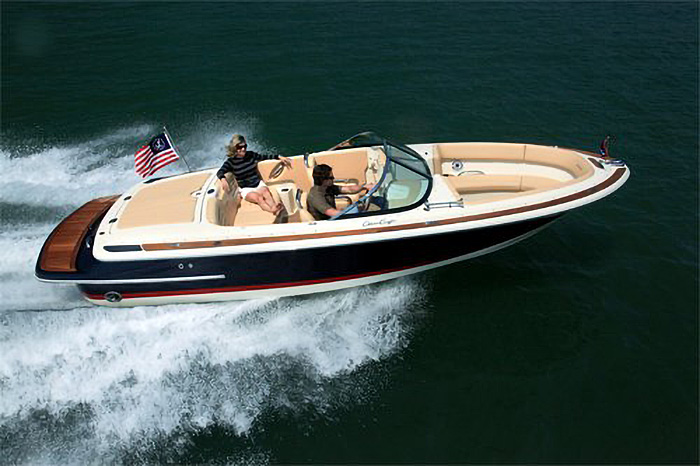 Photo of Chris Craft Powerboat cruising along water