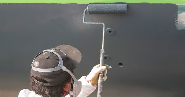 Man Painting Boat Bottom