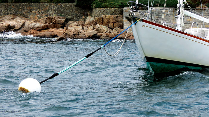 A boat tied to a helix mooring