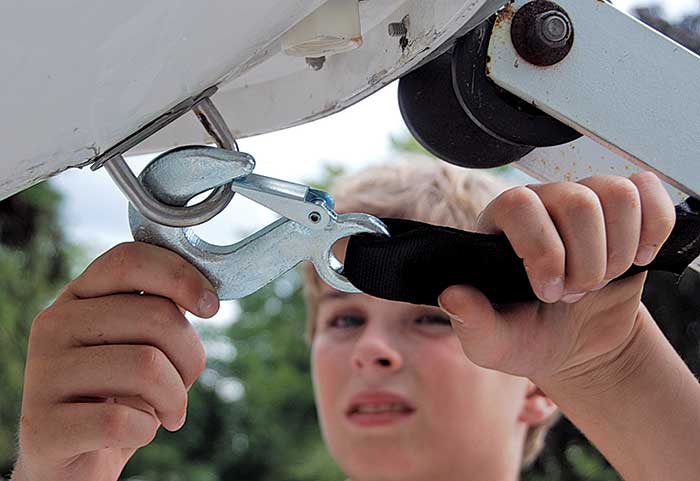 Hook new strap to boat's bow