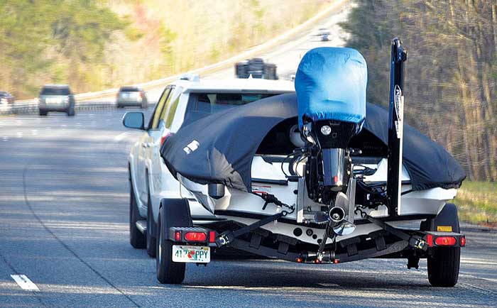 Towing a covered powerboat down the highway
