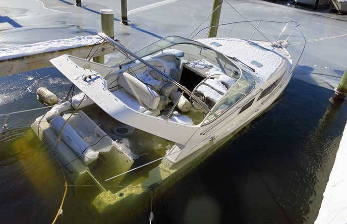 Sunken poowerboat at dock