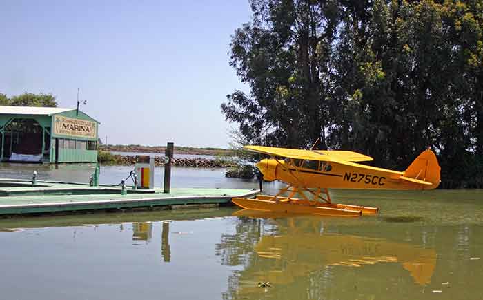 Airplane parked at Pirate's Lair marina