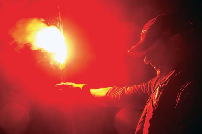 Holding a burning flare