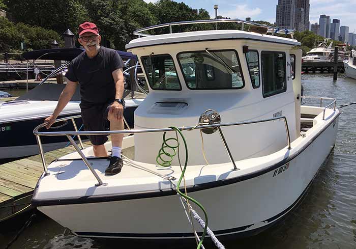 Dick Debartolo aboard his pilothouse powerboat