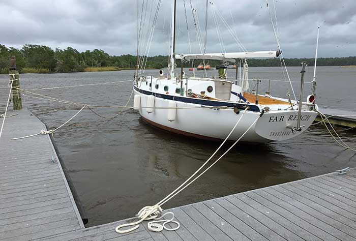 Far Reach is centered in a wide slip with slack lines 