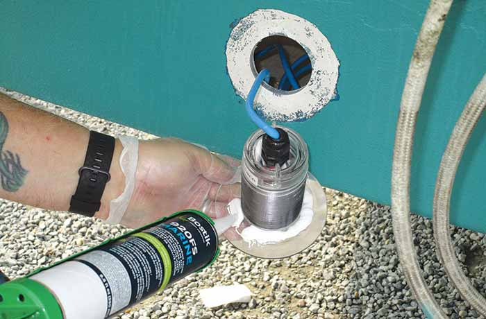 Feeding cable through hole