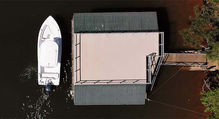 Operator using joystick to position around docks