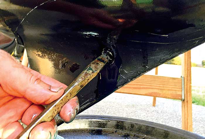 Tighten lower gearcase drain