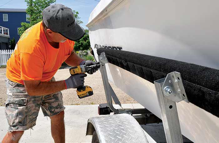 Screwing bracket onto bunkboard