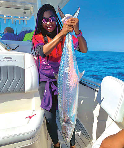 Bobbiette Palmer shows off one of seven king mackerels