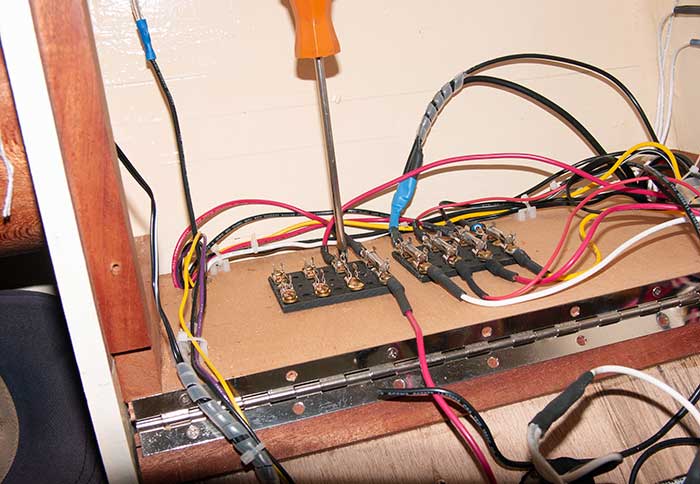 Running tiller wires back to the electrical panel and making electrical connections