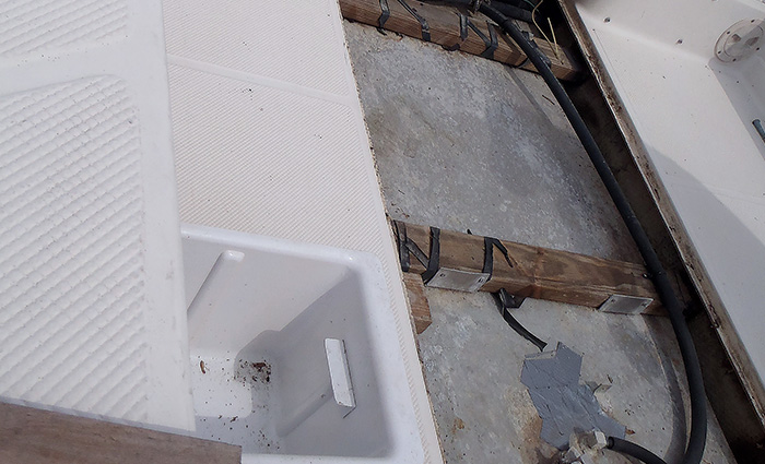 Example of a fuel tank and hoses accessible via a large opening in the cockpit deck