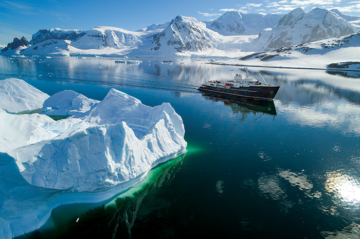 Large white and black cruise ship going through the Canadian Rideau Canal