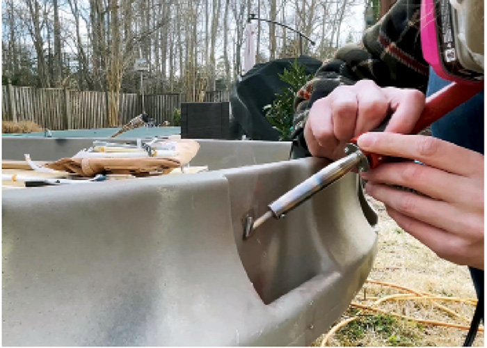 Photo of a plastic component on a boat being welded.