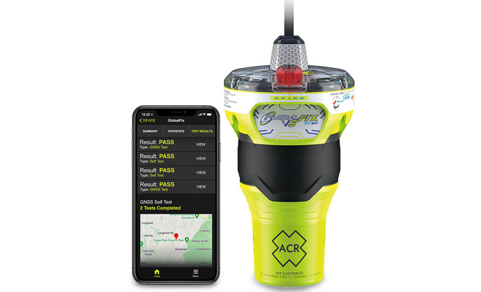 A neon-green beacon next to a black mobile phone displaying app capabilities.