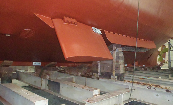 Red fin stabilizer on the bottom of a vessel.