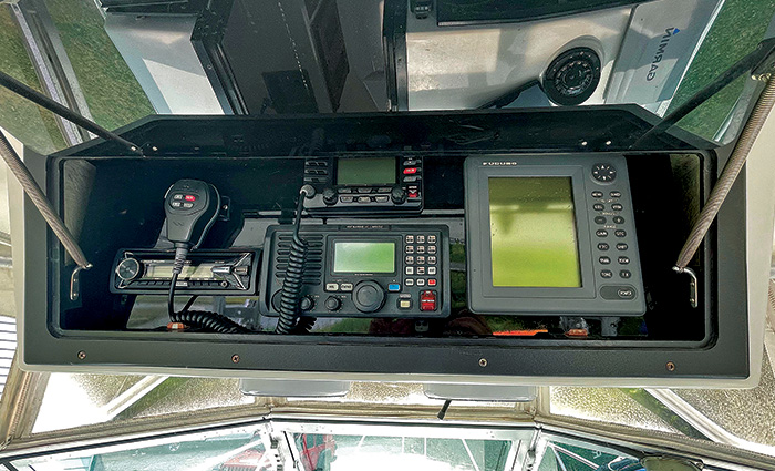 Overhead view of  various boat electronics in a steel protective case.