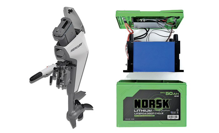 Interior view of a Norsk Lithium battery next to a gray and white Mercury motor.