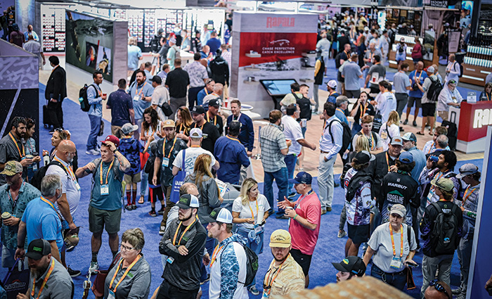 Large group of people wearing lanyards attending a conference.
