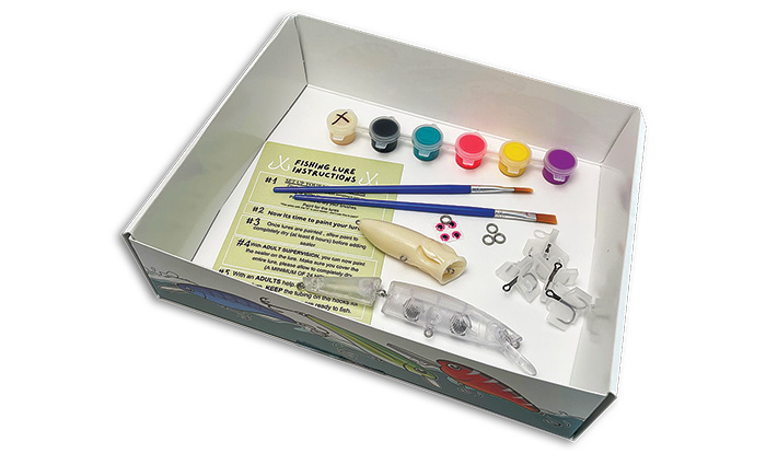 Silver tray with various craft tools to create self-made fishing lures