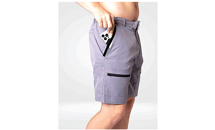 Adult male wearing gray and black trunks.