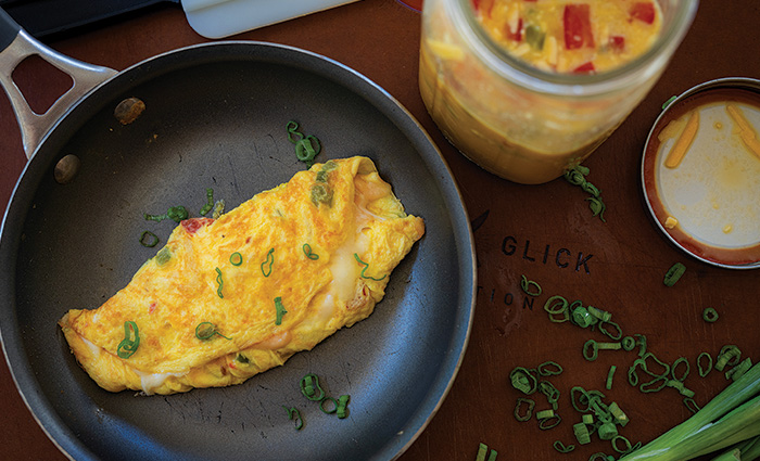 An omelet in a black frying pan. 