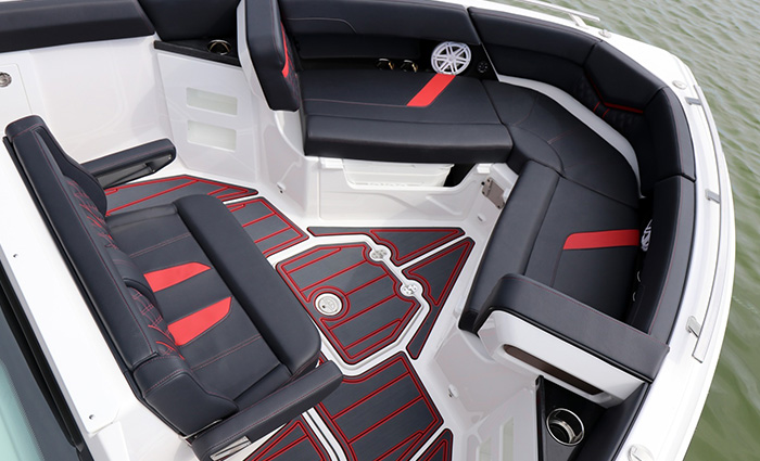 Vessel bow showcasing black and red leather seating with various cupholders.