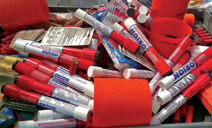 Numerous flares with orange, white and blue labels in a gray box.