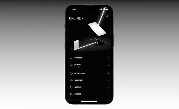 Black mobile phone displaying an app in use aligning an antenna and indicating it is online. 