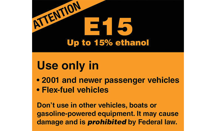 Black and orange advertisement for ethanol fuel.