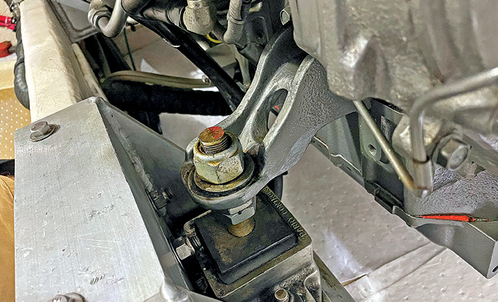 A clean and functioning silver and black engine mount.